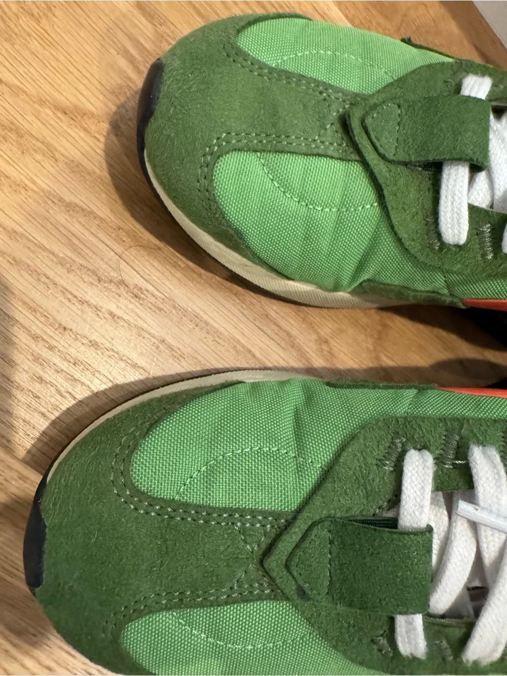 Nike Air Max Pre-Day LX Green with Orange Swoosh. Unisex.
